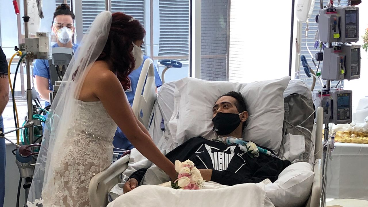 The happy couple were married with the weakened groom still in his hospital bed.