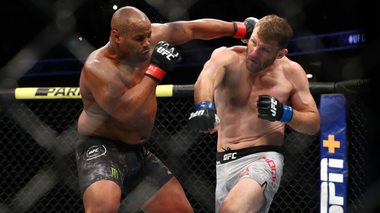 Cormier throws a punch at Miocic in the first round during their UFC heavyweight bout in 2019.