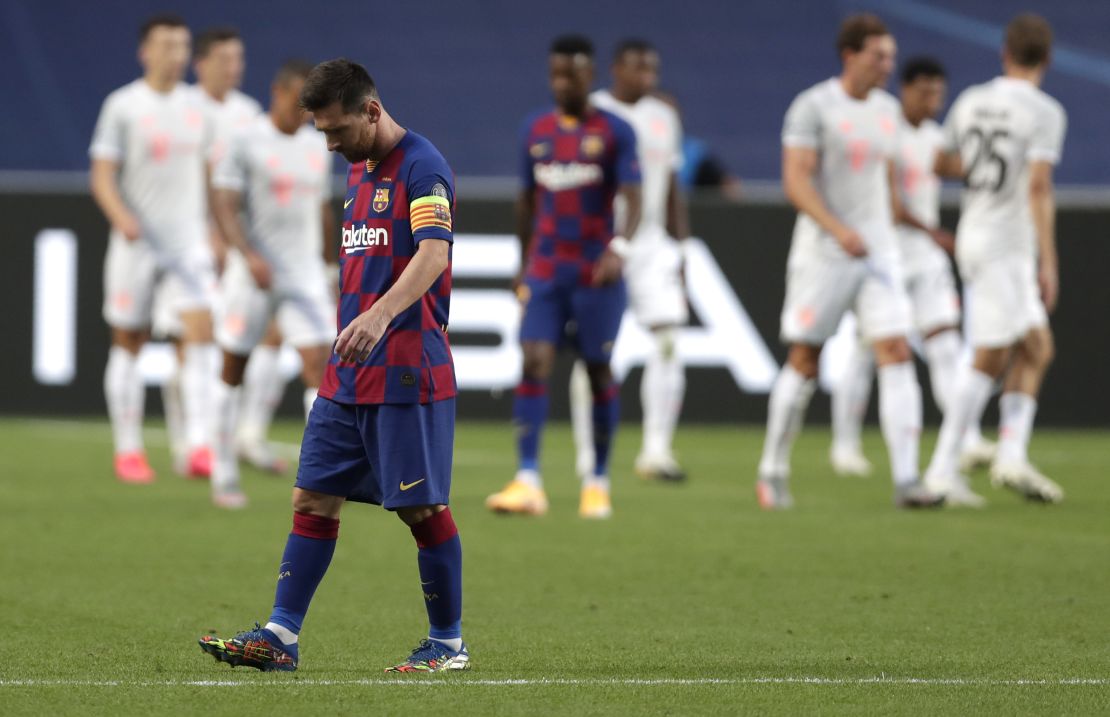Messi reacts after Bayern Munich scores.