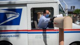 United States Postal Service mail carrier Frank Colon, 59, delivers mail amid the coronavirus pandemic on April 30, 2020 in El Paso, Texas.