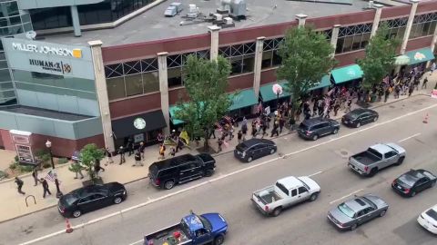 The group marched in downtown Kalamazoo before meeting counter protesters near Arcadia Creek Festival Place.