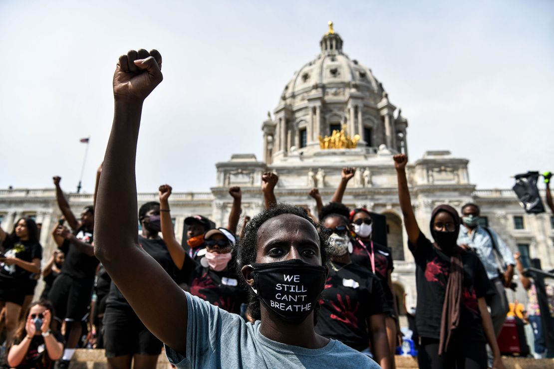 Demonstrators raise their fists on June 2, 2020 at the State Capitol in Saint Paul, Minnesota, where thousands gathered to protest over the death of George Floyd.