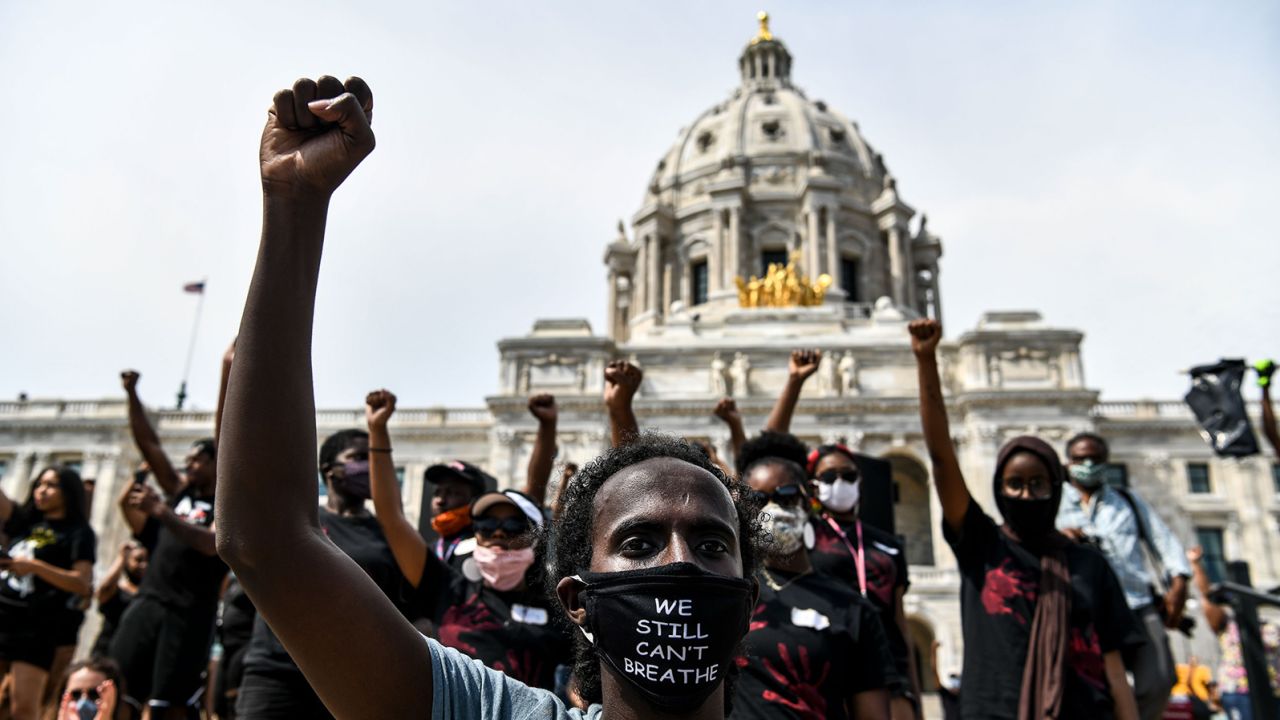 Demonstrators raise their fists on June 2, 2020 at the State Capitol in Saint Paul, Minnesota, where thousands gathered to protest over the death of George Floyd.