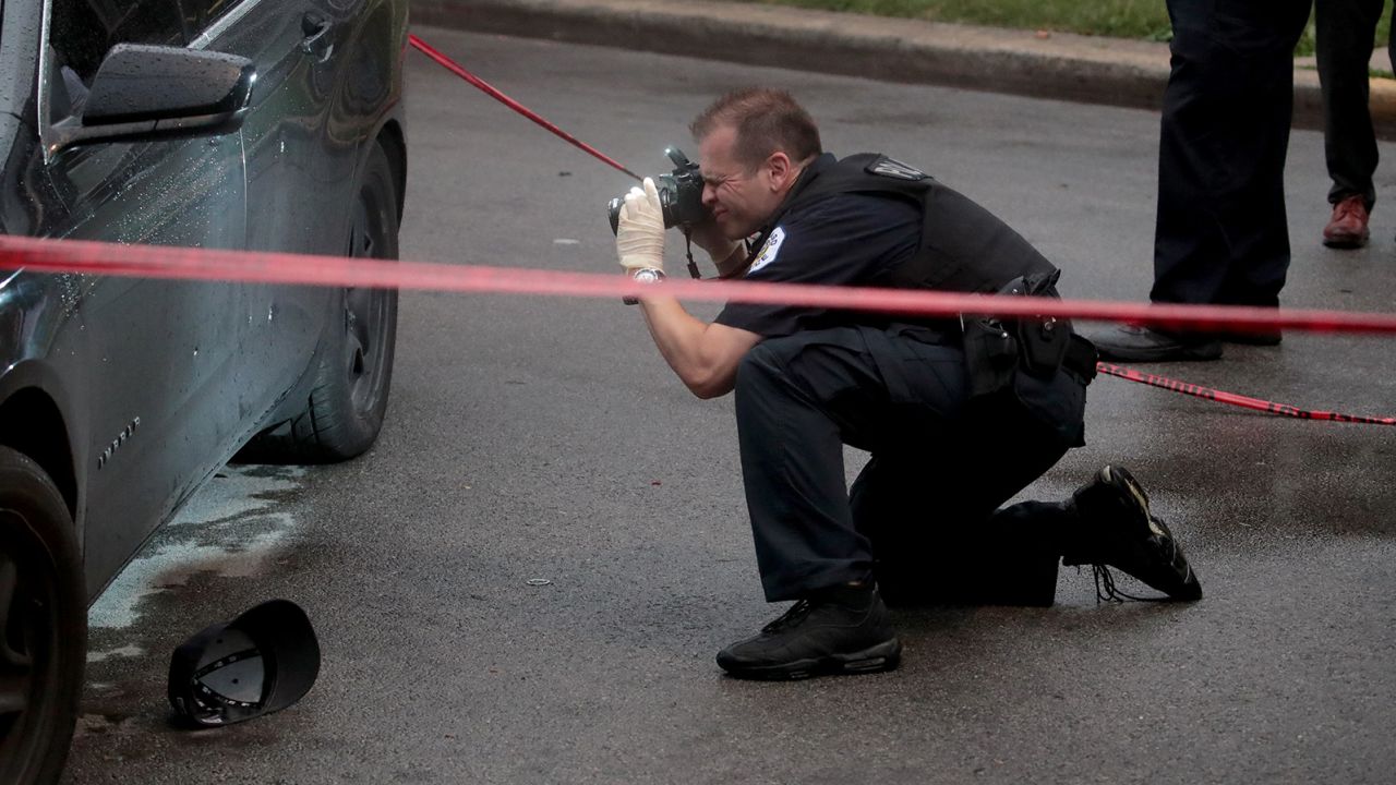 Police investigate the scene of a shooting in Chicago on July 21, 2020. Homicides in the city are up 33% in the first three months of the year compared to 2020, while shootings are up nearly 40% for the same period year-over-year.