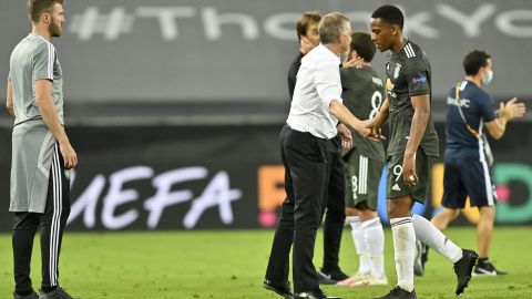 Solskjaer (second right) consoles Anthony Martial (right) after defeat to Sevilla.
