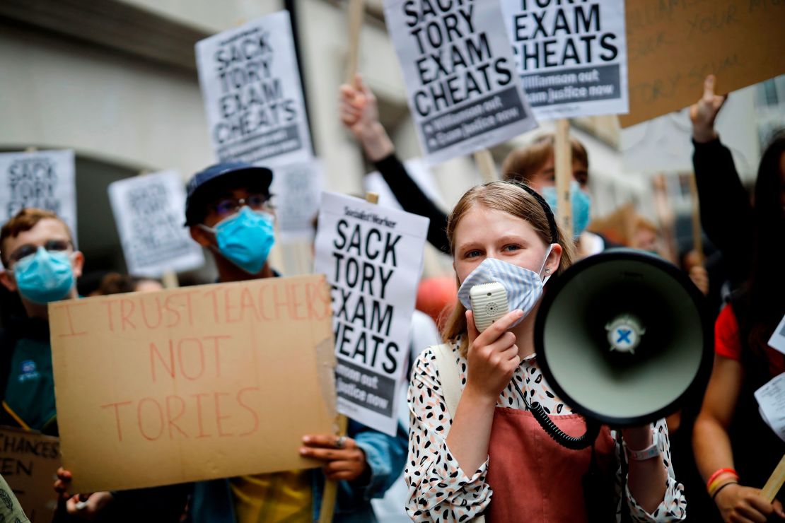 Students hold placards at a protest outside the Department for Education in London, the day after the A-level results were announced.