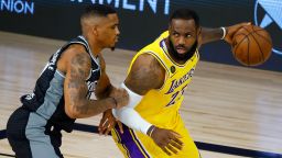 Sacramento Kings' DaQuan Jeffries, left, defends against Los Angeles Lakers' LeBron James during the second quarter of an NBA basketball game Thursday, Aug. 13, 2020, in Lake Buena Vista, Fla. (Kevin C. Cox/Pool Photo via AP)
