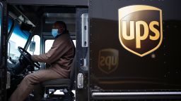 A United Parcel Service Inc. (UPS) delivery driver wears a protective mask while operating a delivery truck to delivery N95 respirator masks outside a United Parcel Service Inc. (UPS) Ground sorting facility in Louisville, Kentucky, U.S., on Monday, April 13, 2020. UPS donated 10,000 N95 respirator masks to the Kentucky Emergency Management Agency to be distributed to hospitals across the commonwealth to aid in the fight against COVID-19. Photographer: Luke Sharrett/Bloomberg via Getty Images