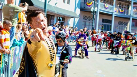 Ray Cannata, pastor of Redeemer Presbyterian Church, dressed up as Elvis Presley with his Elvi krewe at the Iris Parade during Mardis Gras season..