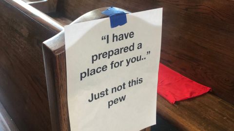 Ray Cannata, pastor of Redeemer Presbyterian Church in New Orleans, printed and taped hundreds of signs encouraging churchgoers to sit apart by referencing Bible scriptures with a funny twist.