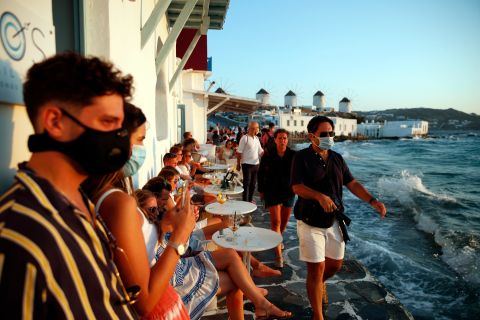 People gather in Little Venice on the Aegean Sea island of Mykonos, Greece, on August 16.