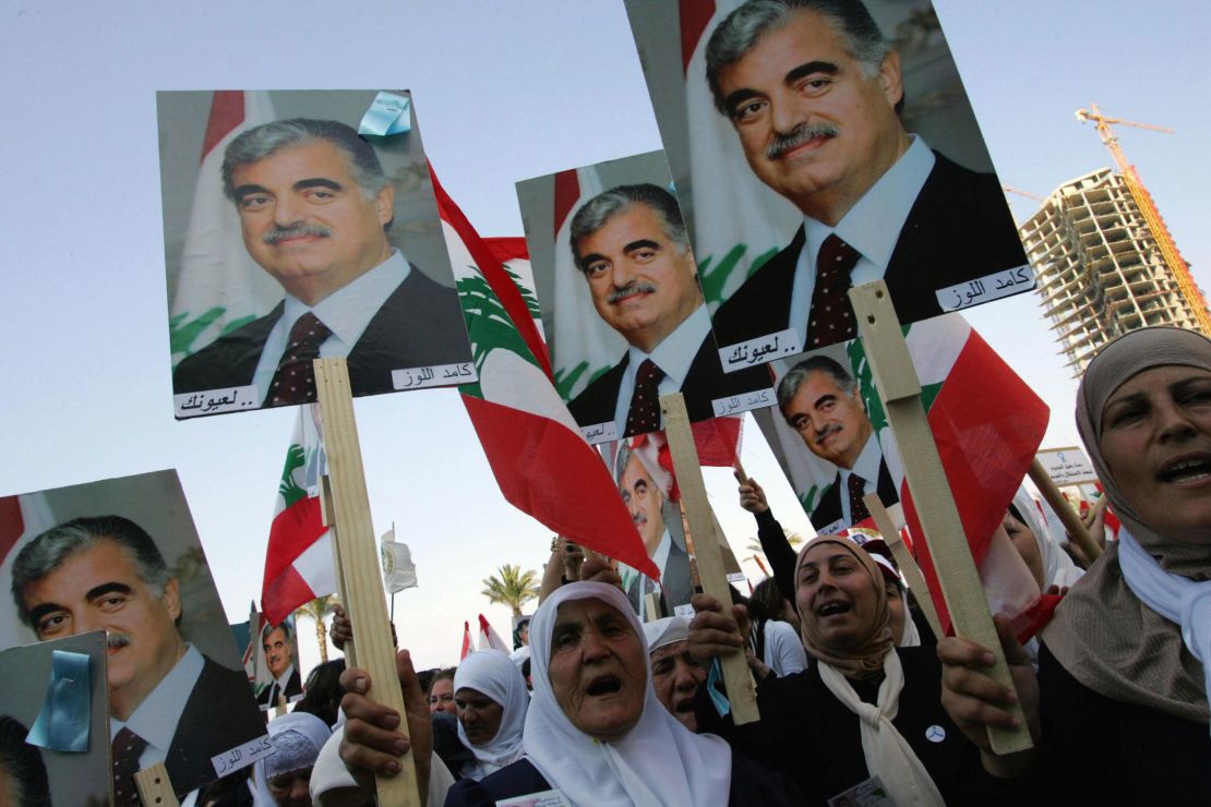 Lebanese women holding posters of Hariri march in Beirut in March 2005. 