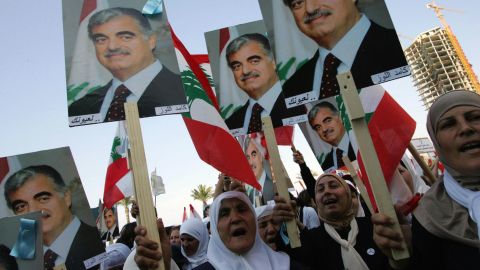 Lebanese women holding posters of Hariri march in Beirut in March 2005.