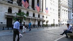 People walk past The New York Stock Exchange (NYSE) on August 3, 2020 at Wall Street in New York City. - Stock markets rose on both sides of the Atlantic August 3, 2020 as hopeful economic data prompted bargain hunting, with some of Asia's equities markets also making solid gains. (Photo by Angela Weiss / AFP) (Photo by Angela Weiss/AFP/Getty Images)