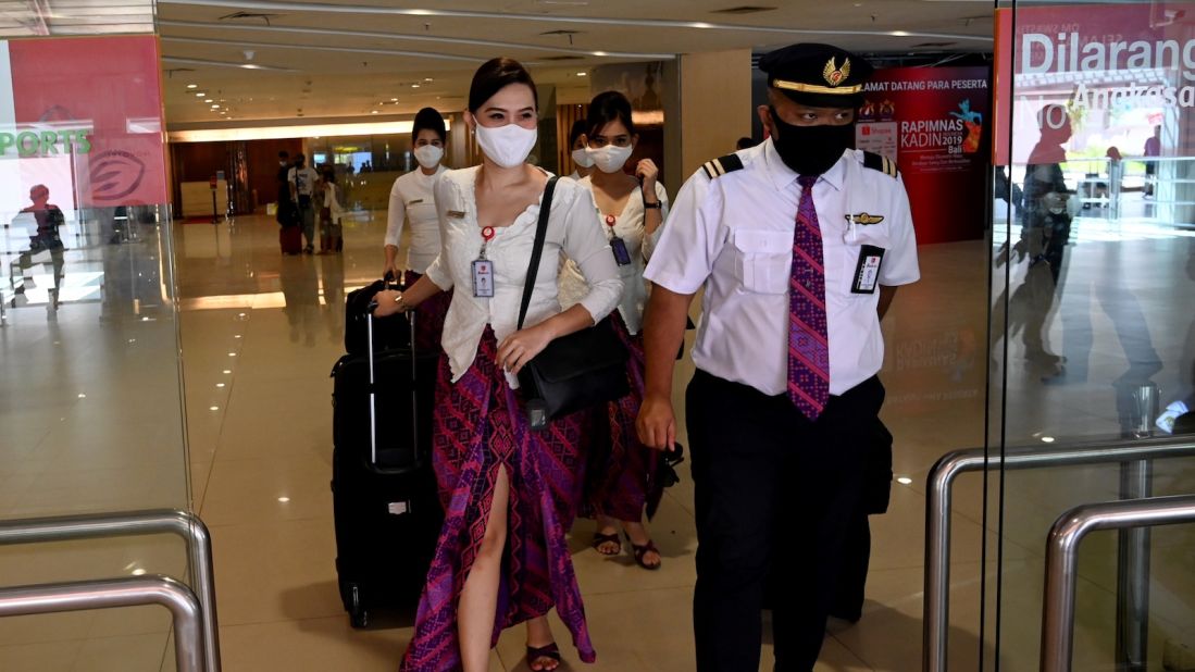 <strong>Domestic flights resume: </strong>Crew members arrive at Ngurah Rai International Airport on July 31, the first day domestic tourism was permitted to resume in Bali following months of closure due to the Covid-19 pandemic.  
