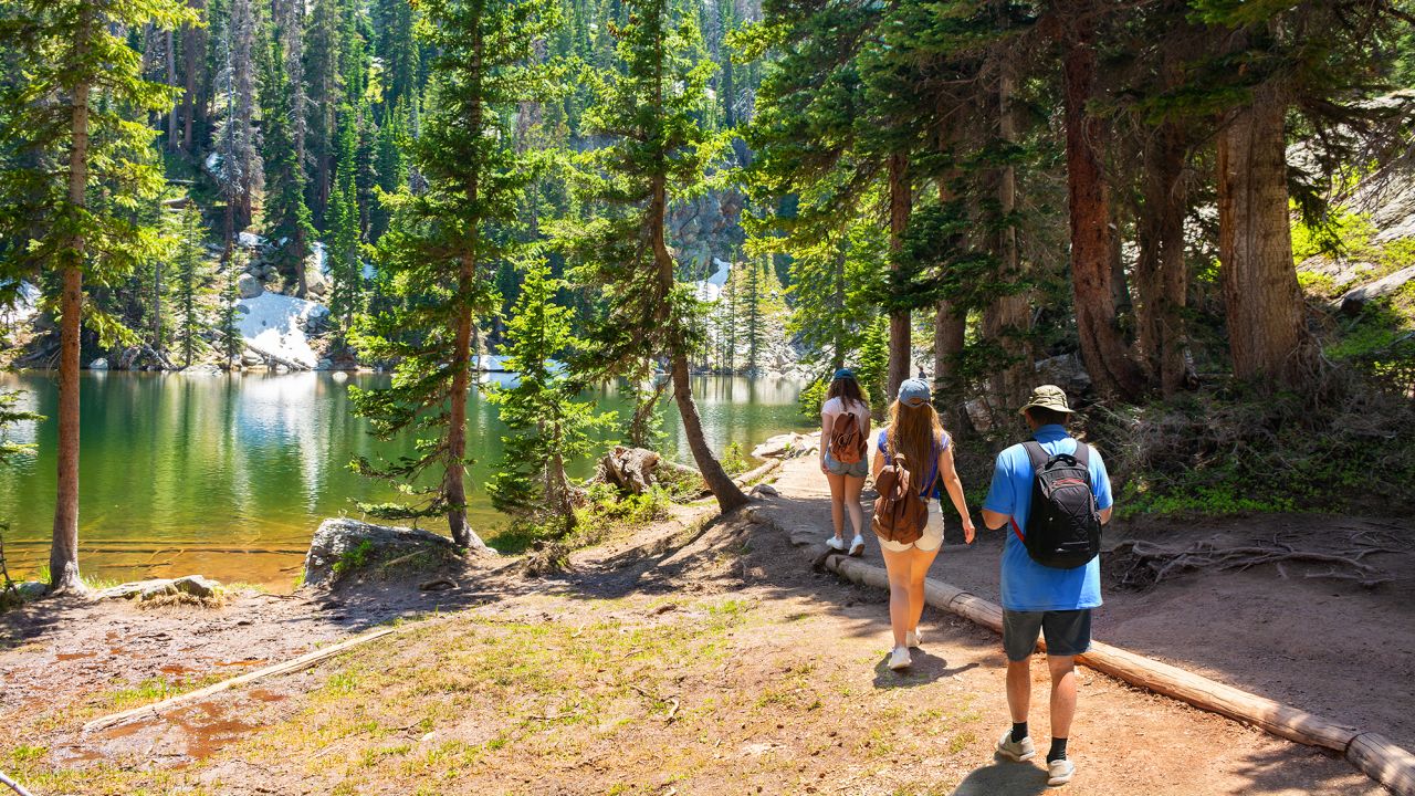 It's the right time to hike. One good spot is Emerald Lake Trail, next to Dream Lake, Rocky Mountains National Park in Colorado.