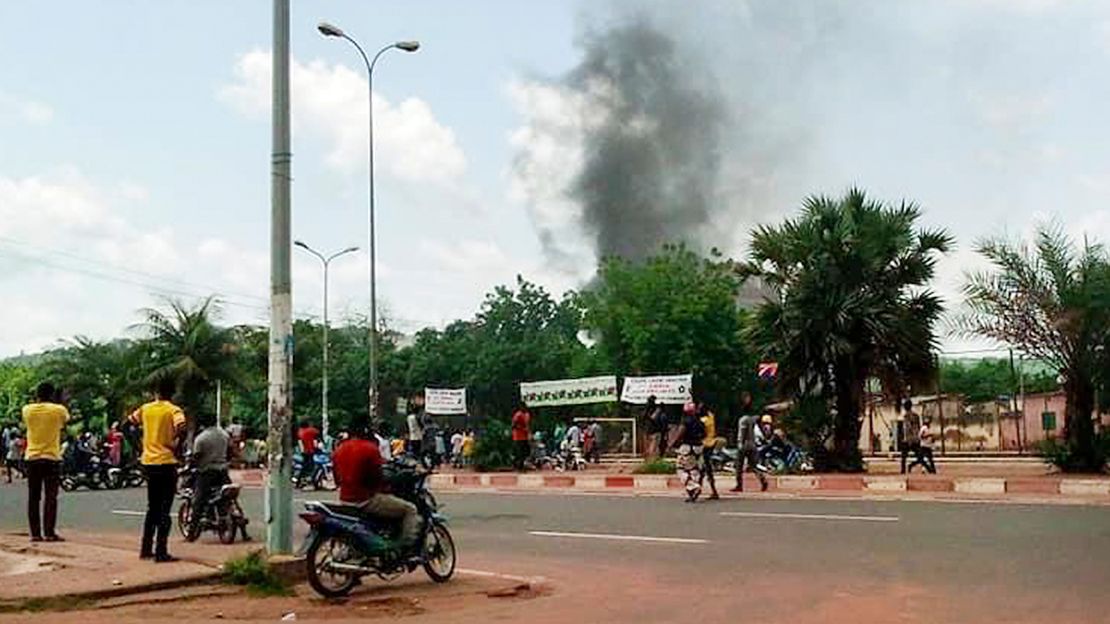 Smoke rises from the residence of Mali's finance minister Kassim Tapo in Bamako on Aug. 18, 2020. 