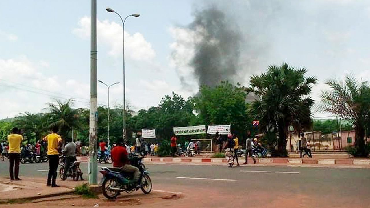 Smoke rises from the residence of Mali's finance minister Kassim Tapo in Bamako on Aug. 18, 2020. 