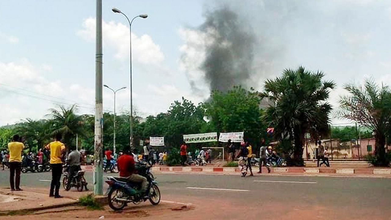 Smoke rises from the residence of Mali's finance minister Kassim Tapo in Bamako on Aug. 18, 2020.