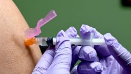 A man gets a flu shot at a health facility in Washington, DC January 31, 2020.