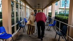 Elderly residents walks inside of the John Knox Village, a retirement community in Pompano Beach, Florida on March 21, 2020.  (Photo by Chandan Khanna/AFP/Getty Images)