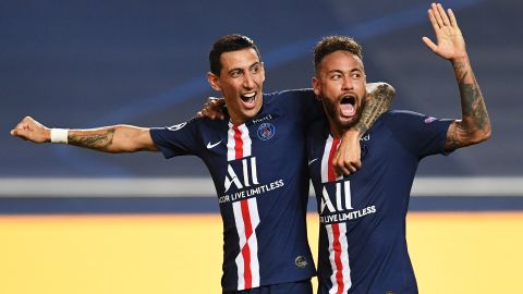 Angel Di Maria celebrates with Neymar after doubling PSG's lead.