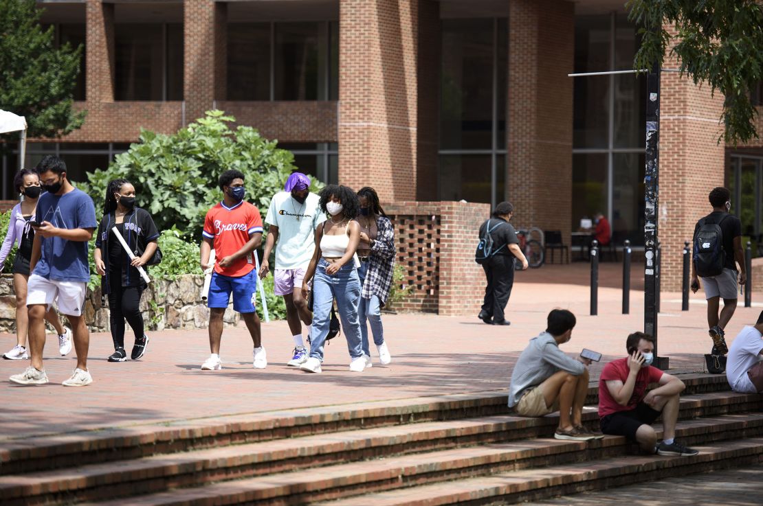 Students walk through the campus of the University of North Carolina at Chapel Hill in August. The university canceled classes after clusters of coronavirus cases appeared.