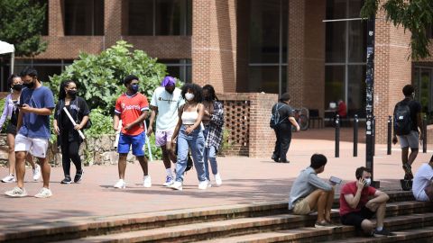Students walk through the campus of the University of North Carolina at Chapel Hill in August. The university canceled classes after clusters of coronavirus cases appeared.