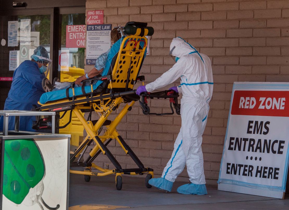 A patient is taken from an ambulance to the emergency room of a hospital in the Navajo Nation town of Tuba City, Arizona, on May 24, 2020.