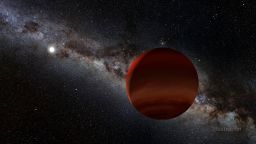 In this illustration, the small white orb represents a white dwarf (a remnant of a long-dead Sun-like star), while the foreground object is its newly discovered brown dwarf companion, spotted by citizen scientists working with a NASA-funded project called Backyard Worlds: Planet 9. Image Credit: NOIRLab/NSF/AURA/P. Marenfeld/Acknowledgement: William Pendrill