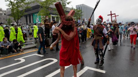 A demonstrator dressed as Jesus marches to the Presidential office during a rally against the government on August 15, 2020 in Seoul, South Korea.