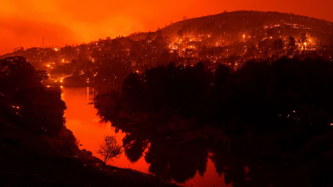 Embers burn along a hillside above Lake Berryessa as the LNU Lightning Complex fires tear through Napa County on August 18, 2020. This image was taken with a long exposure.