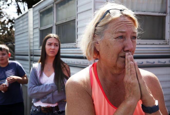Kathy Mathison looks at the still-smoldering wildfire on August 16, 2020, that, just a day before, came within several feet of her home in Bend, Oregon.