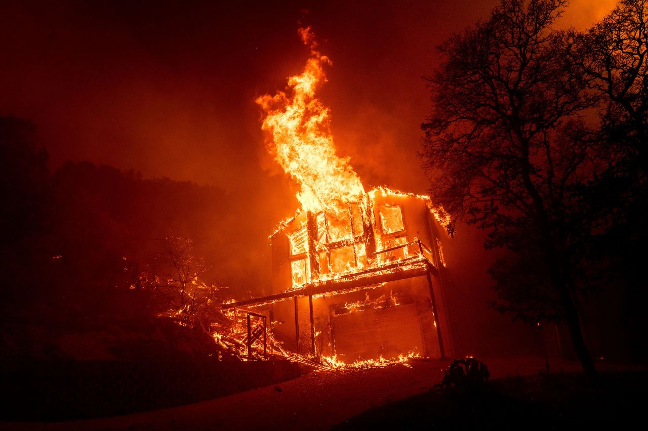 A home burns as the LNU Lightning Complex fires tear through the Spanish Flat community in Napa County on August 18, 2020.