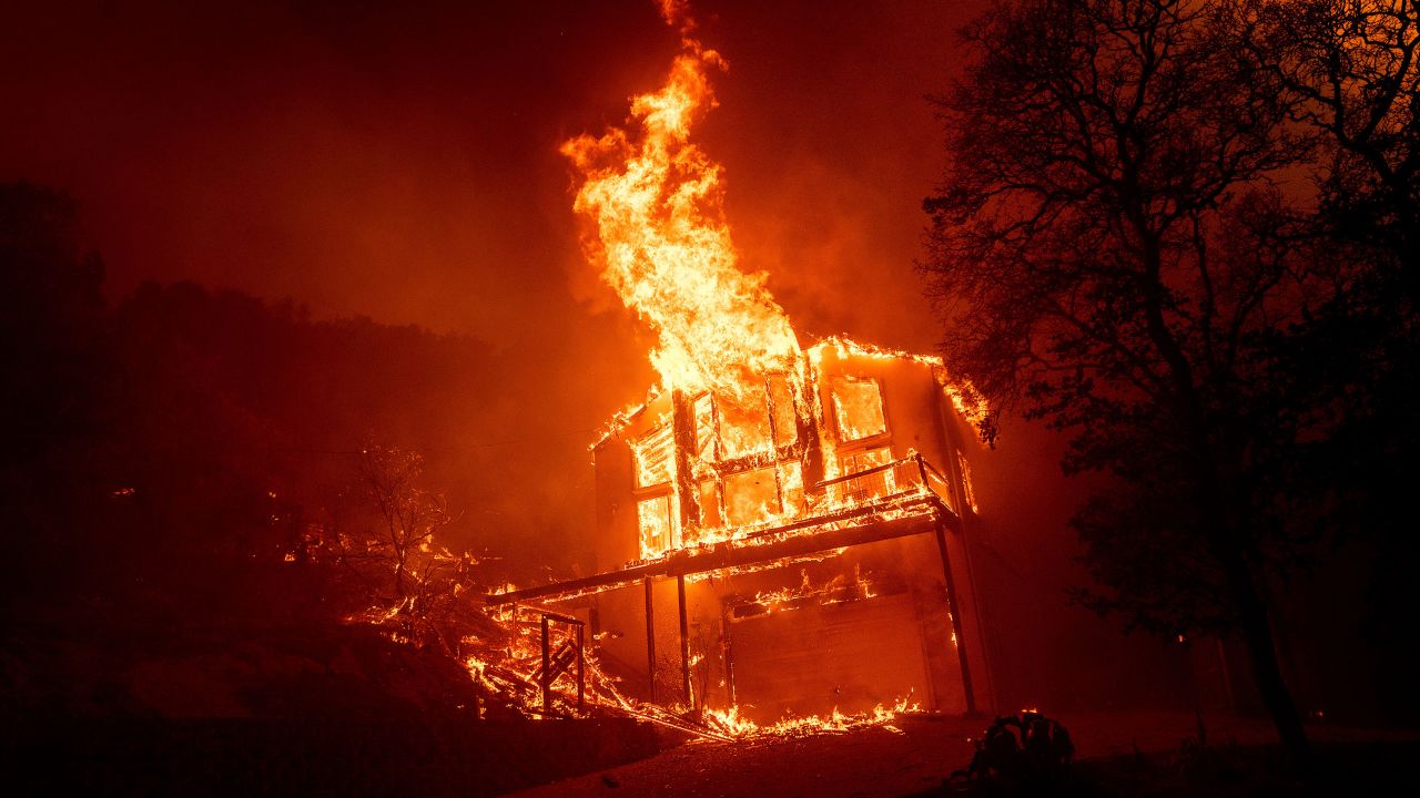A home burns as the LNU Lightning Complex fires tear through the Spanish Flat community in unincorporated Napa County, Calif., Tuesday, Aug. 18, 2020.