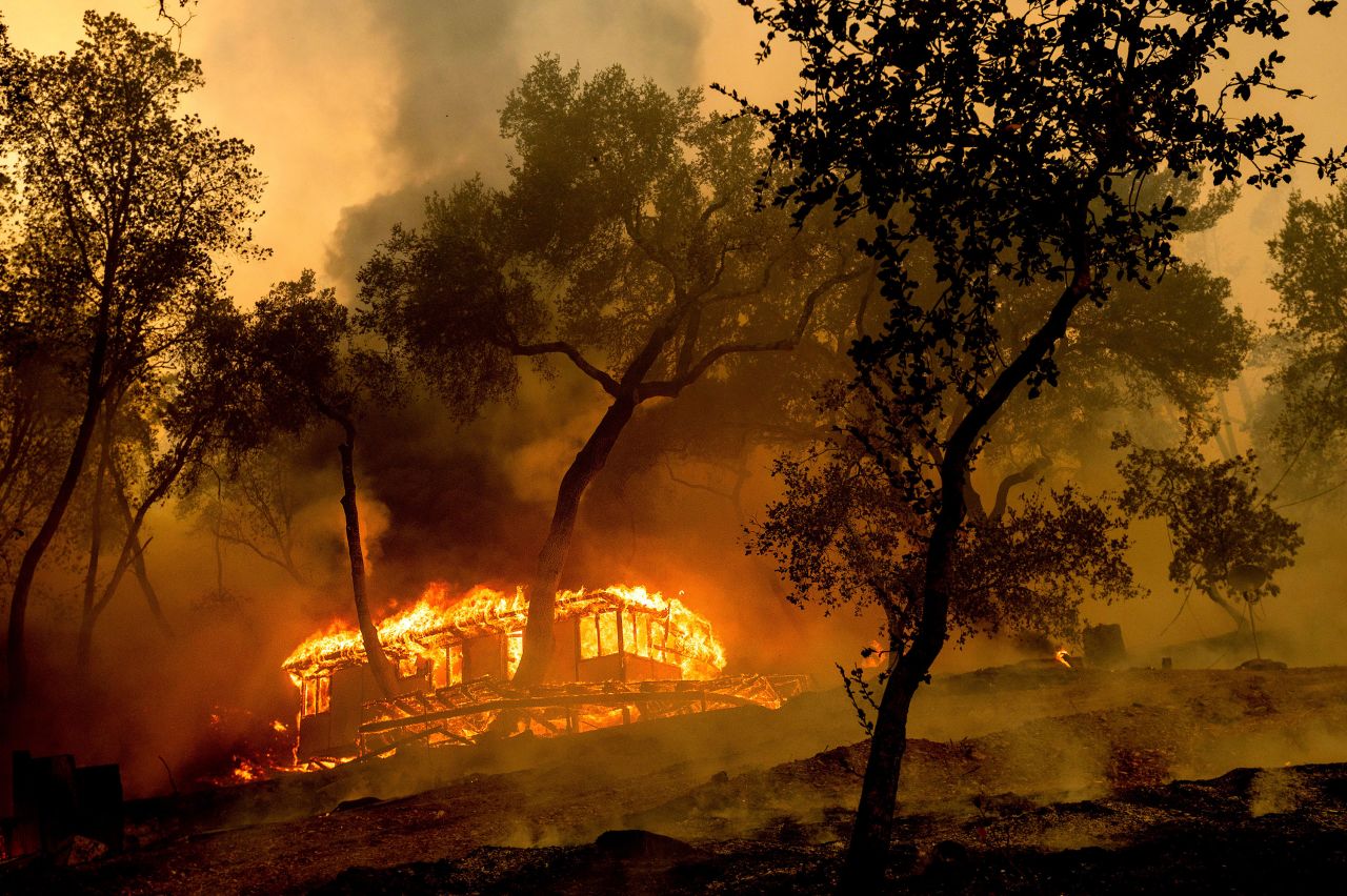 Flames from the Hennessy Fire consume a cabin at the Nichelini Family Winery in Napa County on August 18, 2020.
