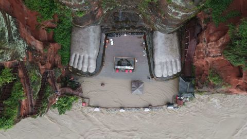 Waters also threatened the Buddha's toes in this photo from August 12.