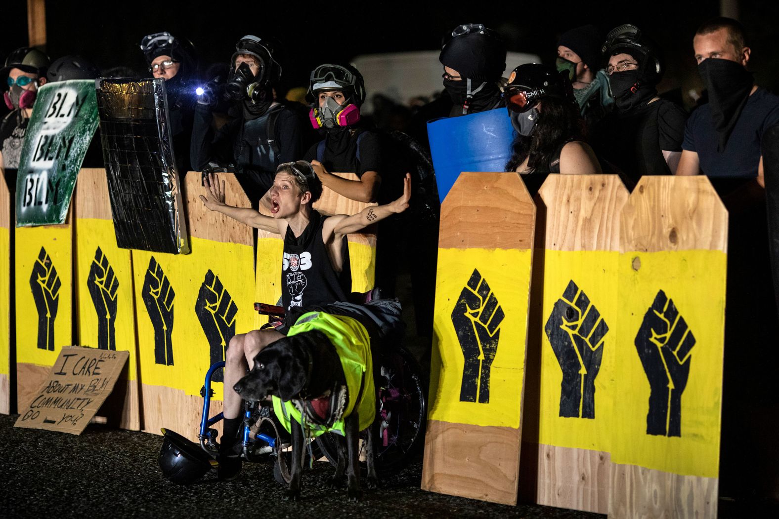 A protester screams at police during a standoff at a Portland precinct on August 15.