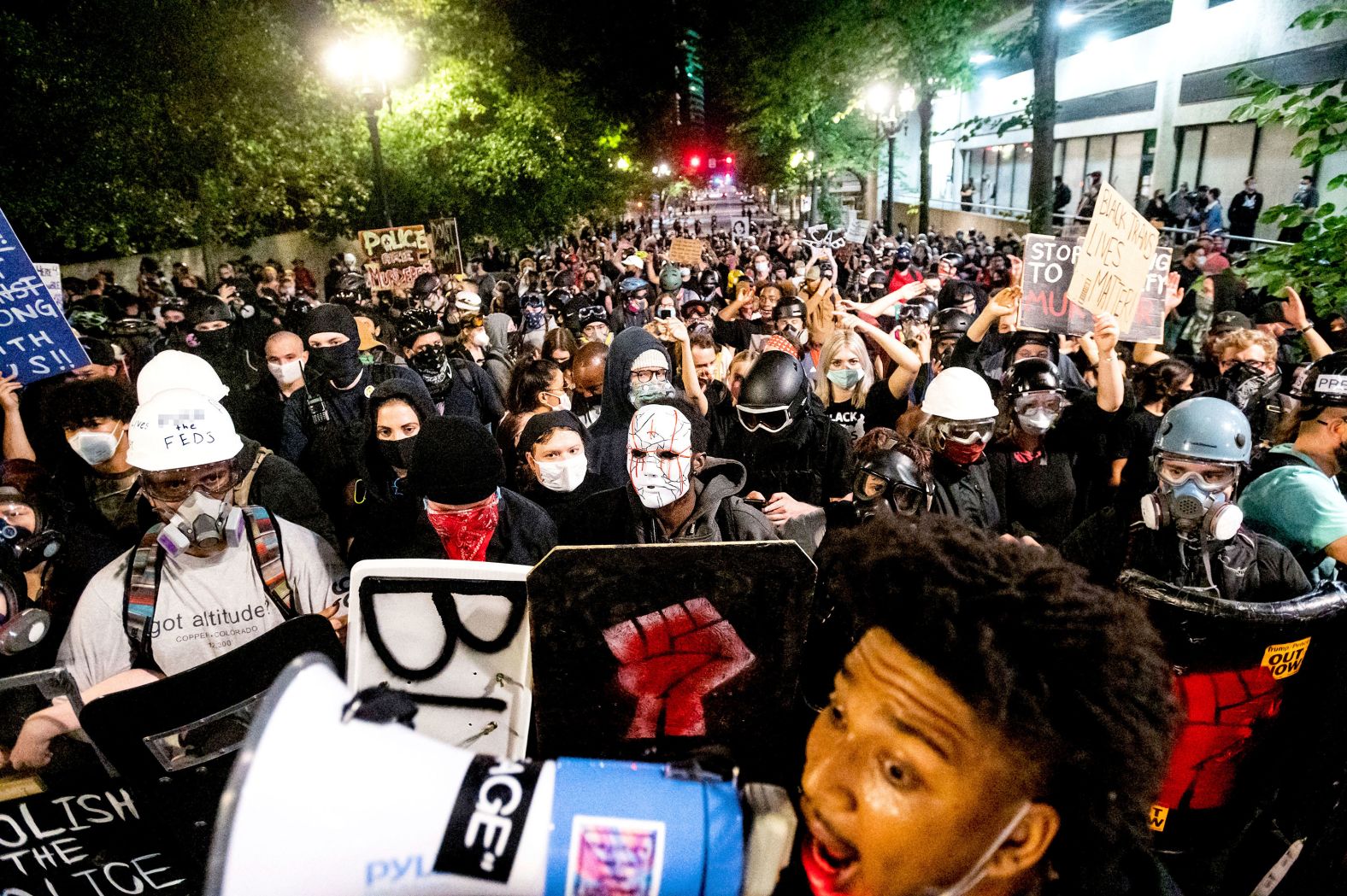 Protesters march through the streets after rallying at the Mark O. Hatfield United States Courthouse on August 2. <em>(Editor's note: Part of this photo has been blurred because of profanity.)</em>