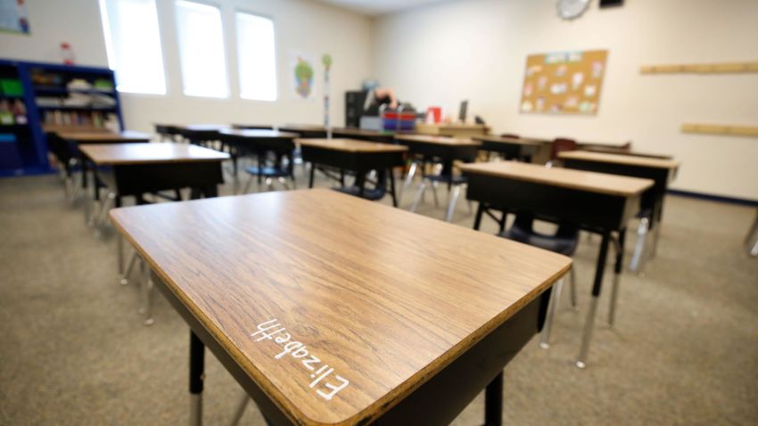 A student's name is written on a desk as a teacher sets up her classroom at Freedom Preparatory Academy as teachers begin to prepare to restart school after it was closed in March due to COVID-19 on August 13, 2020 in Provo, Utah. The school is planning to have students return on August 18 for five days a week instruction, but with reduced hours during the day.