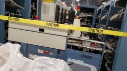 Six delivery bar code sorter machines sit dismantled in a USPS facility in Portland, Oregon in mid-August 2020.
