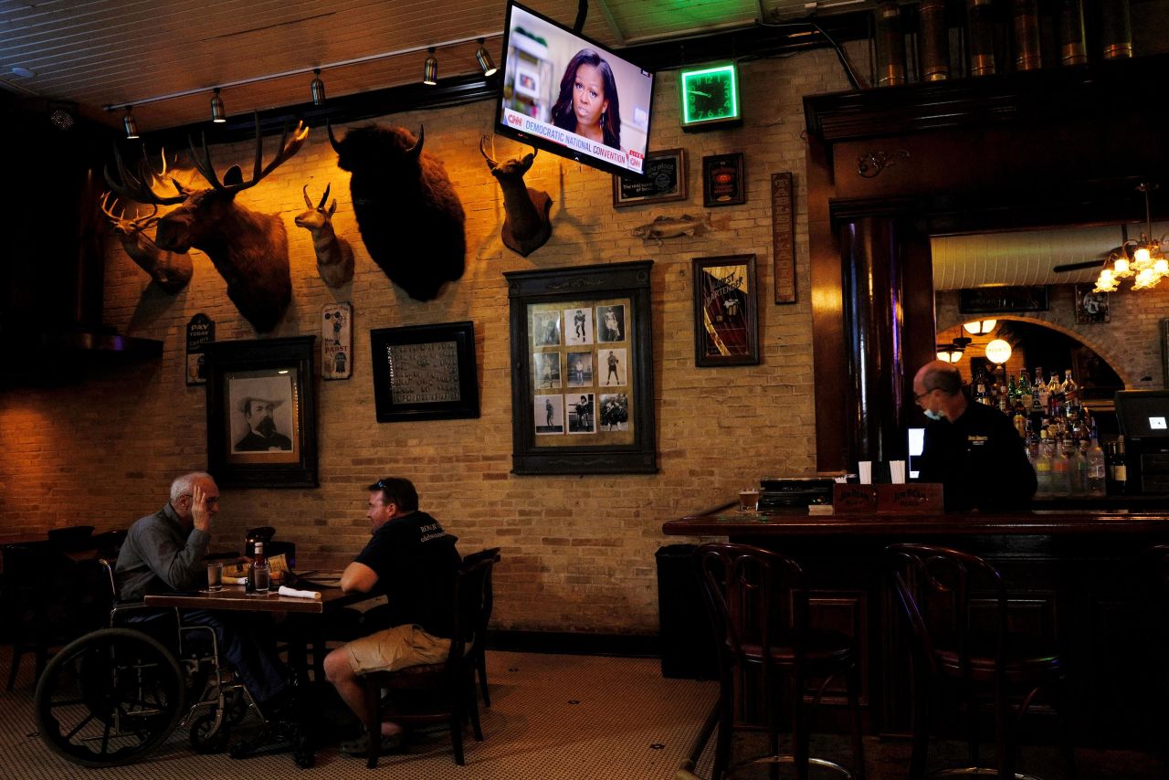 A television at Buck Bradley's Saloon and Eatery, a restaurant in Milwaukee, shows former first lady Michelle Obama giving her convention speech on Monday.