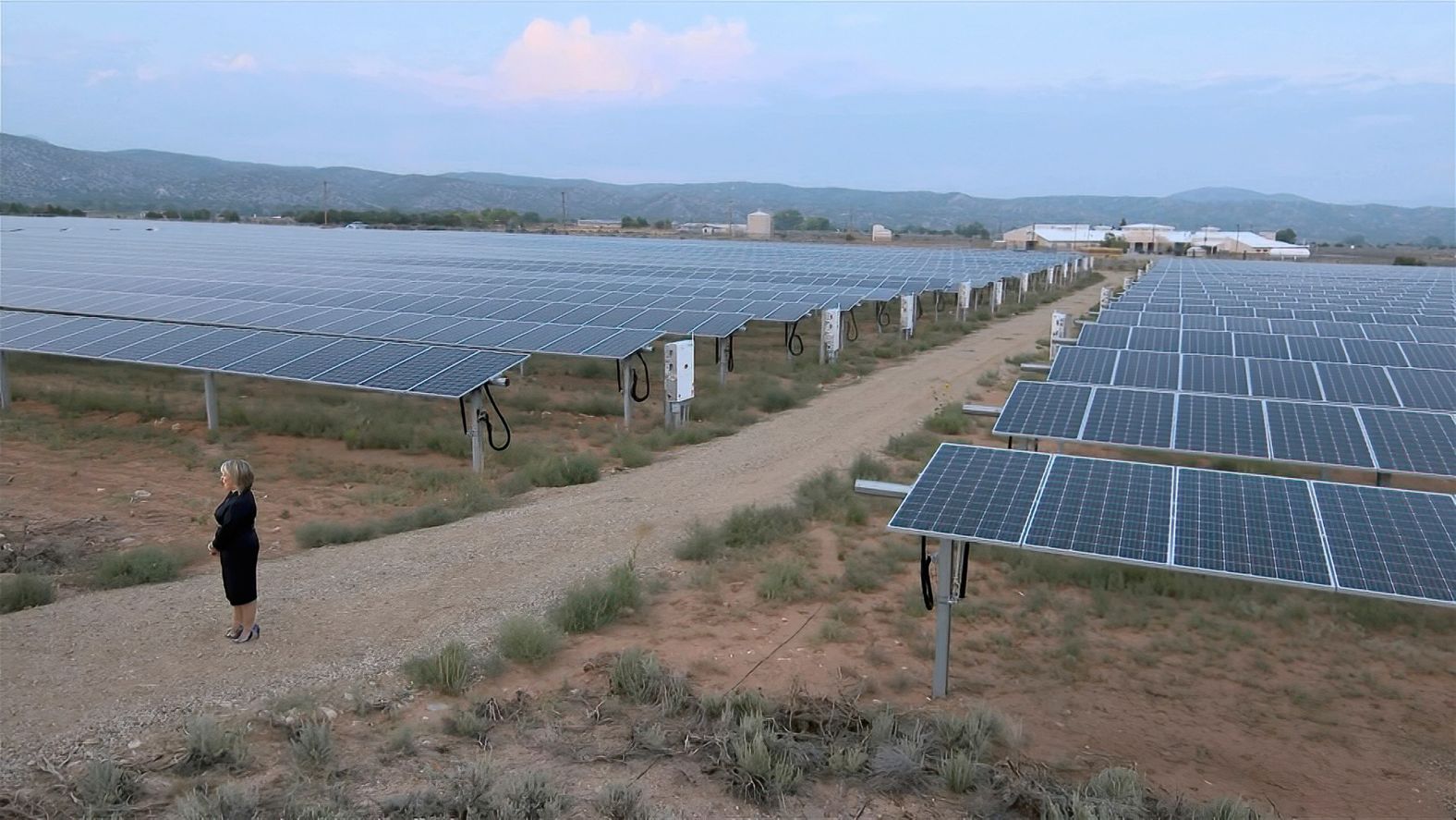 New Mexico Gov. Michelle Lujan Grisham speaks in front of solar panels as she <a href="index.php?page=&url=https%3A%2F%2Fwww.cnn.com%2Fpolitics%2Flive-news%2Fdnc-2020-day-3%2Fh_b25d2470a9dd3beb6b5dd456d347a6c6" target="_blank">addresses climate change.</a> Lujan Grisham, who interviewed to be Biden's running mate, said Biden would rejoin the Paris climate agreement if he is elected president and "invest in clean energy jobs."