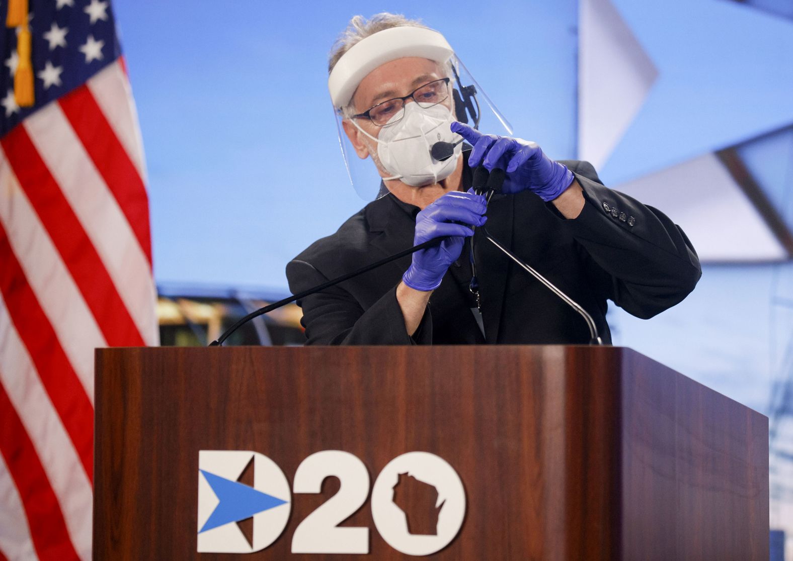 A worker cleans a podium in Milwaukee on Tuesday.