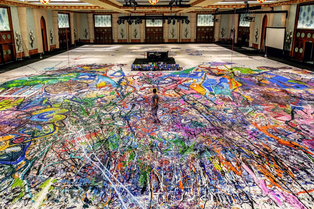 Artist Sacha Jafri at work, in a hotel ballroom in Dubai, on what is expected to be the world's largest painting