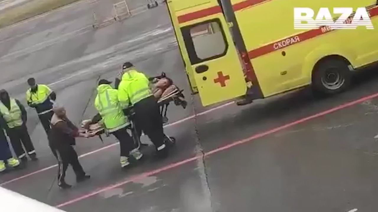 A screenshot of Putin critic Alexey Navalny being loaded onto an ambulance in the Russian city of Omsk after a suspected case of poisoning.