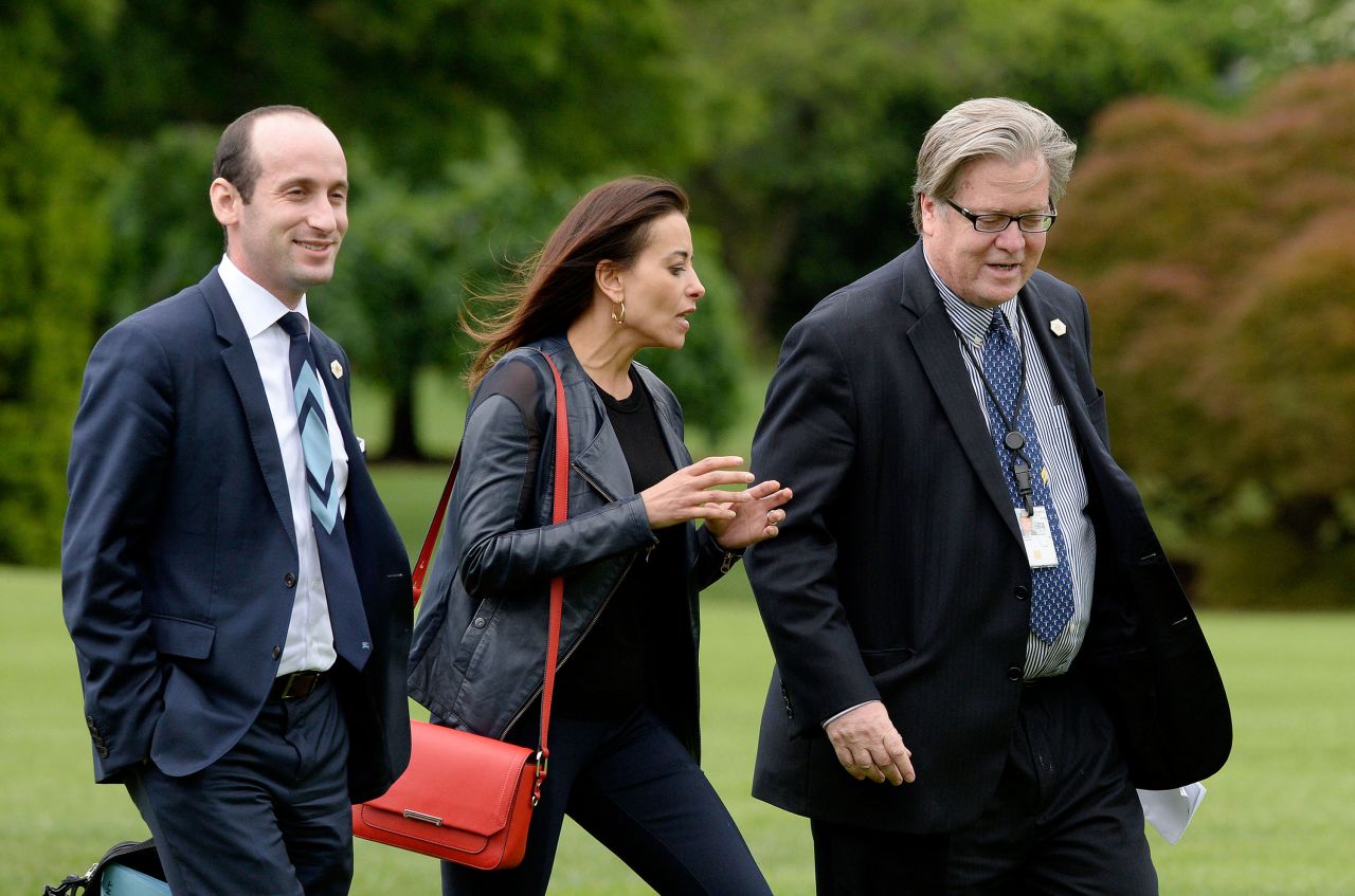 Senior adviser Stephen Miller, deputy national security adviser Dina Powell and Bannon exit Marine One on the South Lawn of the White House in May 2017.