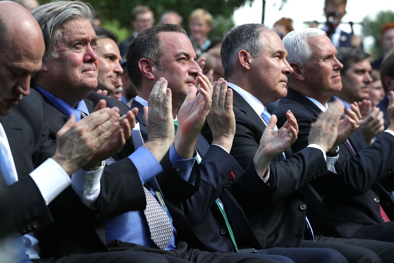 Bannon sits in the Rose Garden of the White House with other members of the Trump administration as Trump announces his decision to pull the United States out of the Paris climate agreement in June 2017.