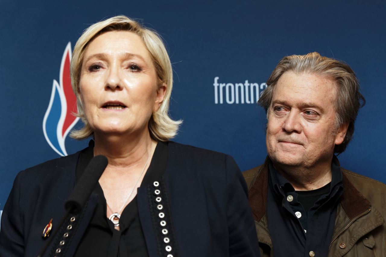 Bannon and Marine Le Pen, president of France's far-right party Front National, hold a joint new conference during the party's annual congress in March 2018.