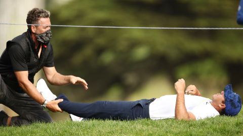 Koepka receives treatment on day two of the 2020 PGA Championship.